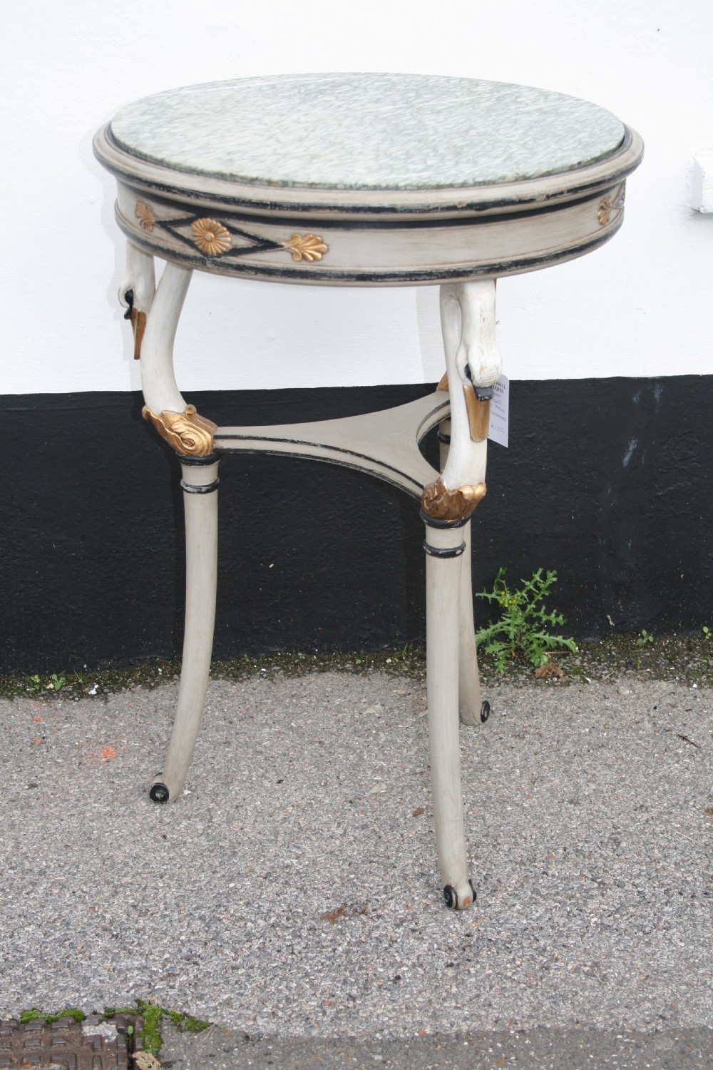 very pretty occasional table surmounted with swans 