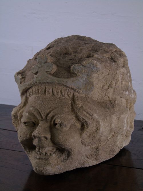 An Early Grotesque Stone Head of a King Possibly 17th Century