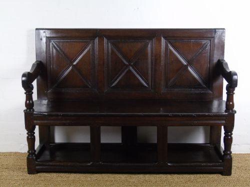A Rare and Unusual Early 17th Century Settle.