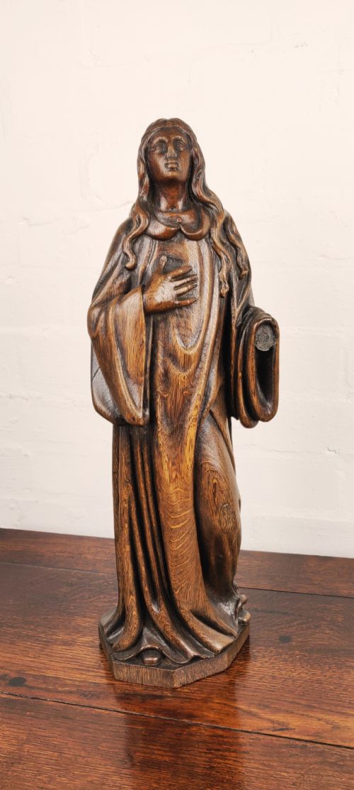 A Late 17th Century Carved Figure Depicting Saint Agnes