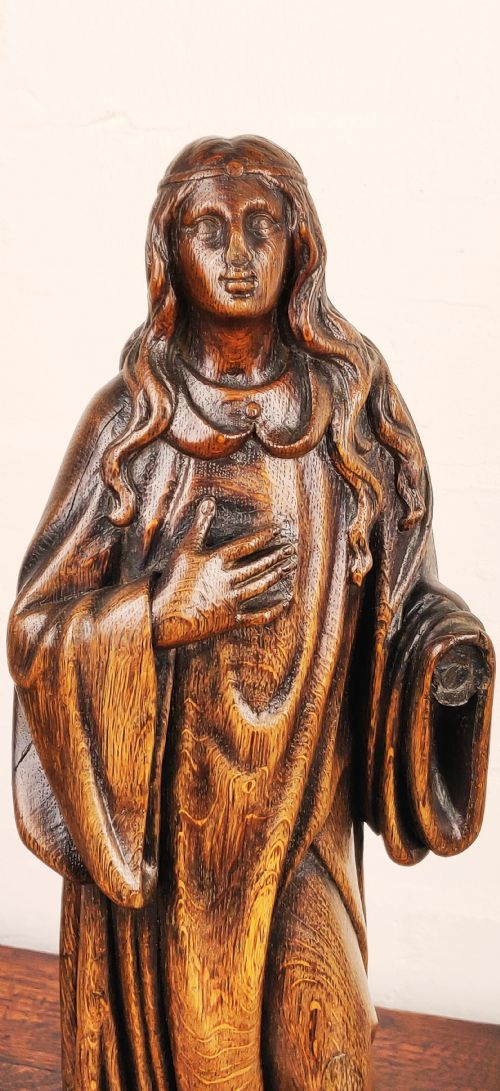 fig 1. A late 17th Century carved figure depicting Saint Agnes