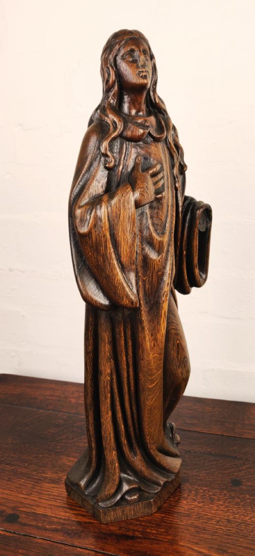 fig 2. A late 17th Century carved figure depicting Saint Agnes