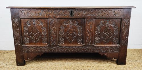A 17th Century Carved Coffer.