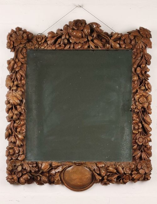 After Grinling Gibbons - A Fine 18thc Carved Mirror.