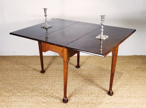 An Elegant 18th Century "Plum Pudding" Drop Leaf Table.