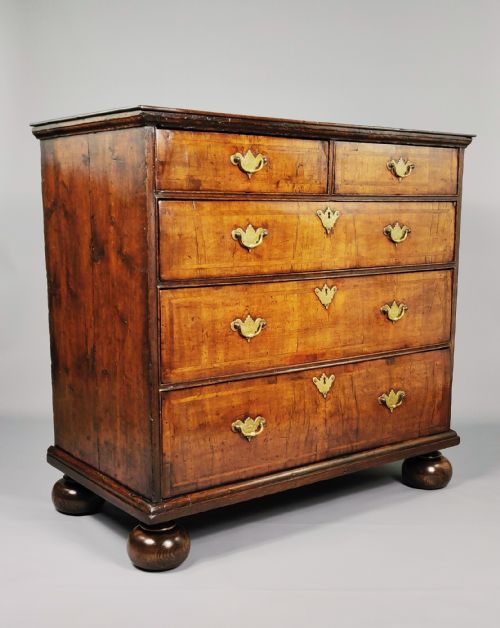 An Early 18th Century Walnut Chest of Drawers.