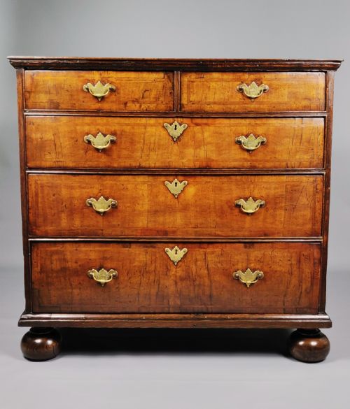 fig 1. An early 18th century walnut chest of drawers.