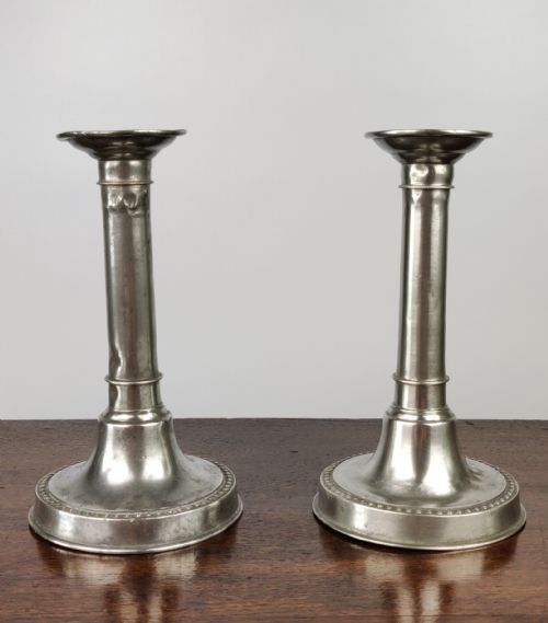 A Pair of Queen Anne Candlesticks.