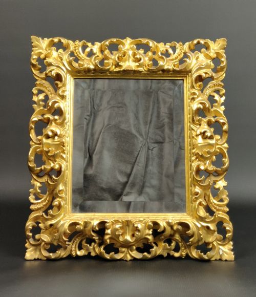 A Small 19th Century Florentine Mirror.
