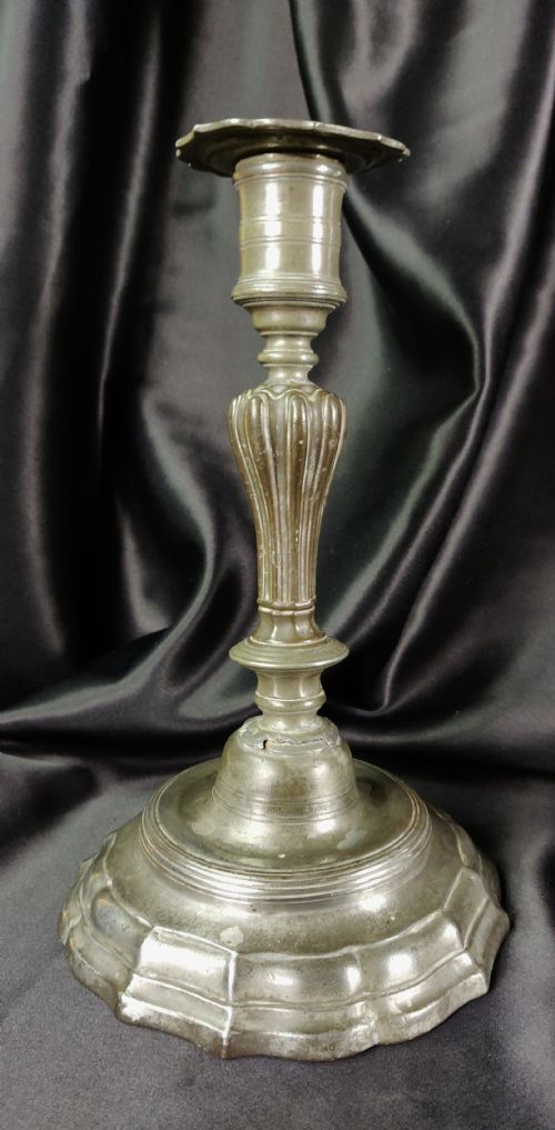 fig 1. A pair of early 18th century pewter candlesticks. 