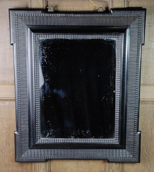 A 19th Century Ripple Molded Mirror.
