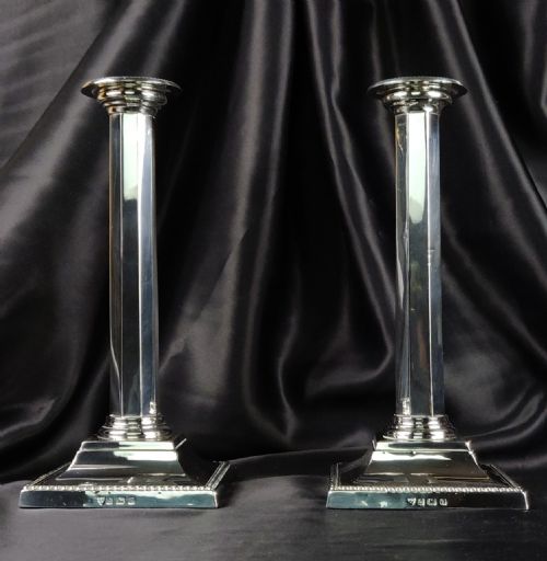 A Fine Pair of Silver Candlesticks.