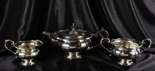A 1930'S Three Piece Silver Tea Set by Walker & Hall.
