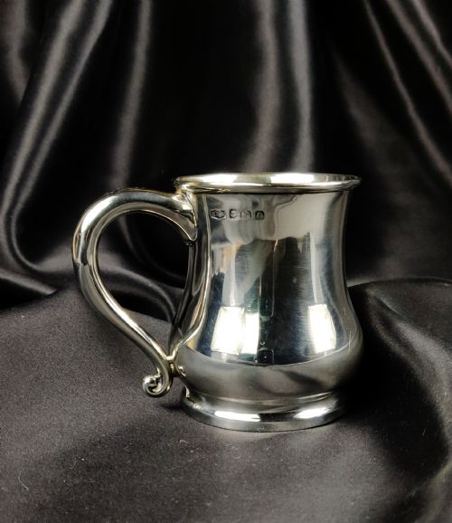 A Late 1930'S Miniature Silver Tankard.