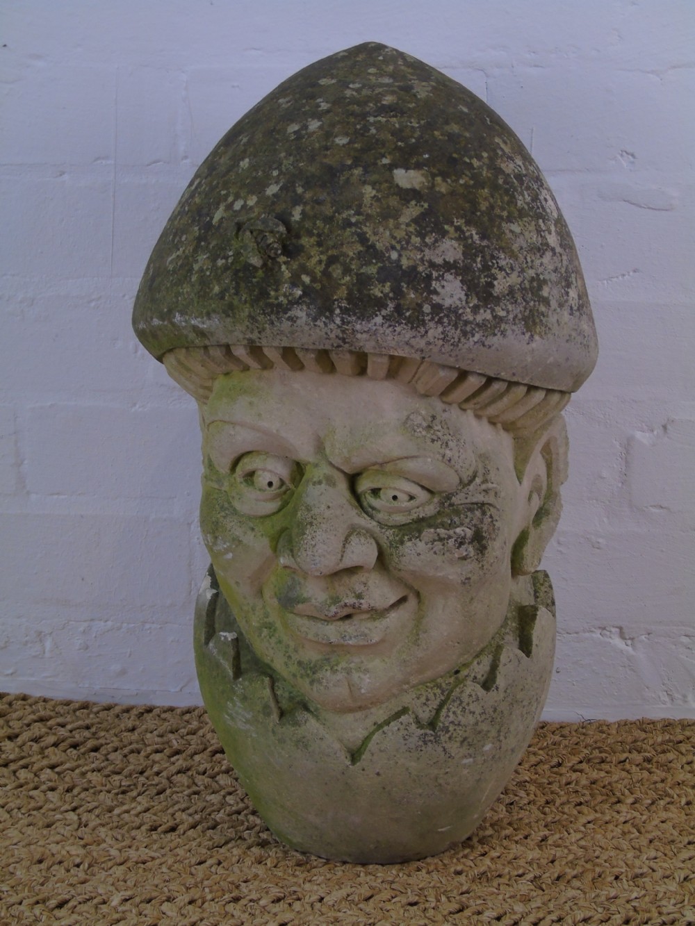 A Late 19th early 20th Century carved limestone head