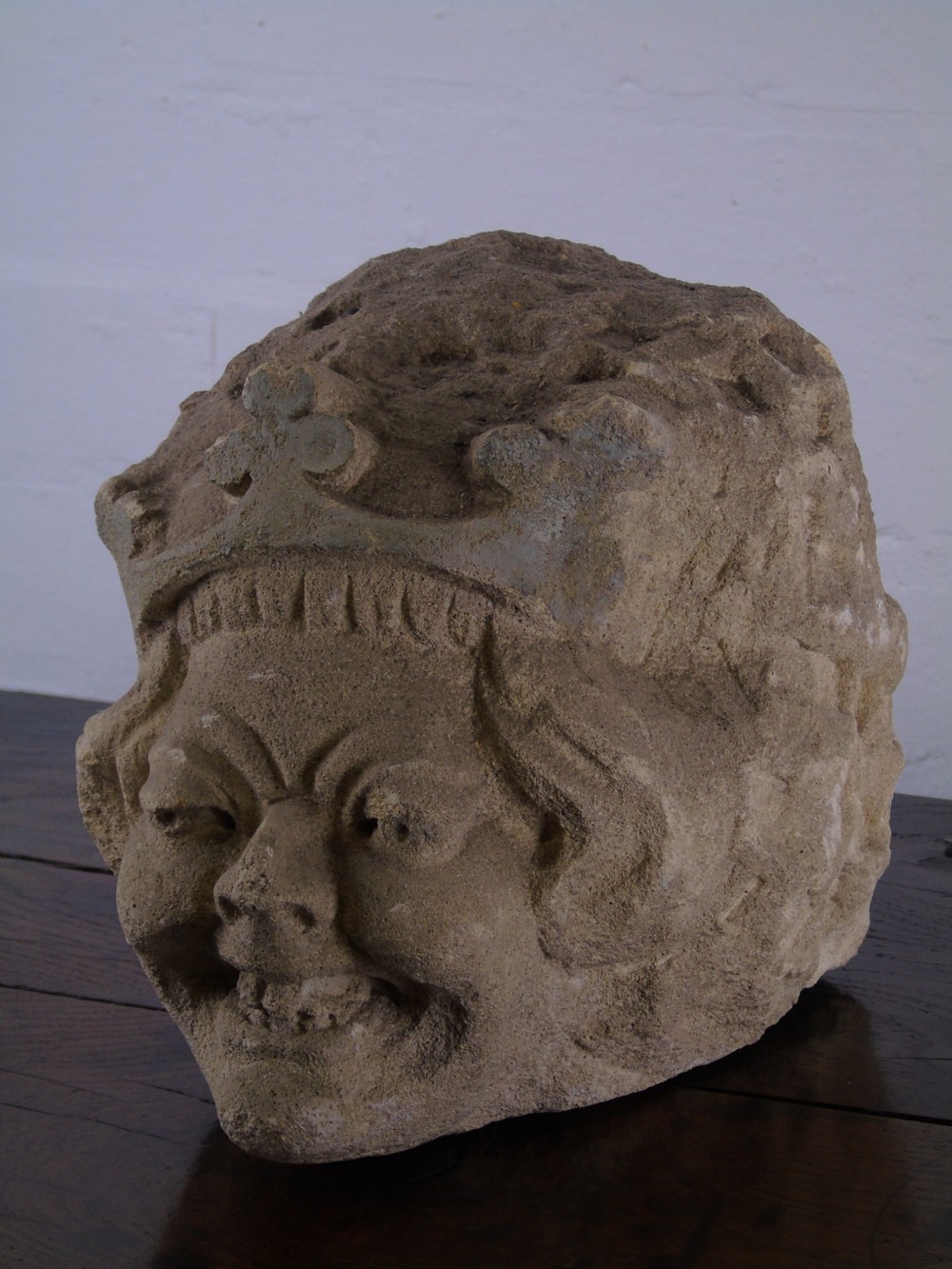 An early Grotesque stone head of a king possibly 17th Century 