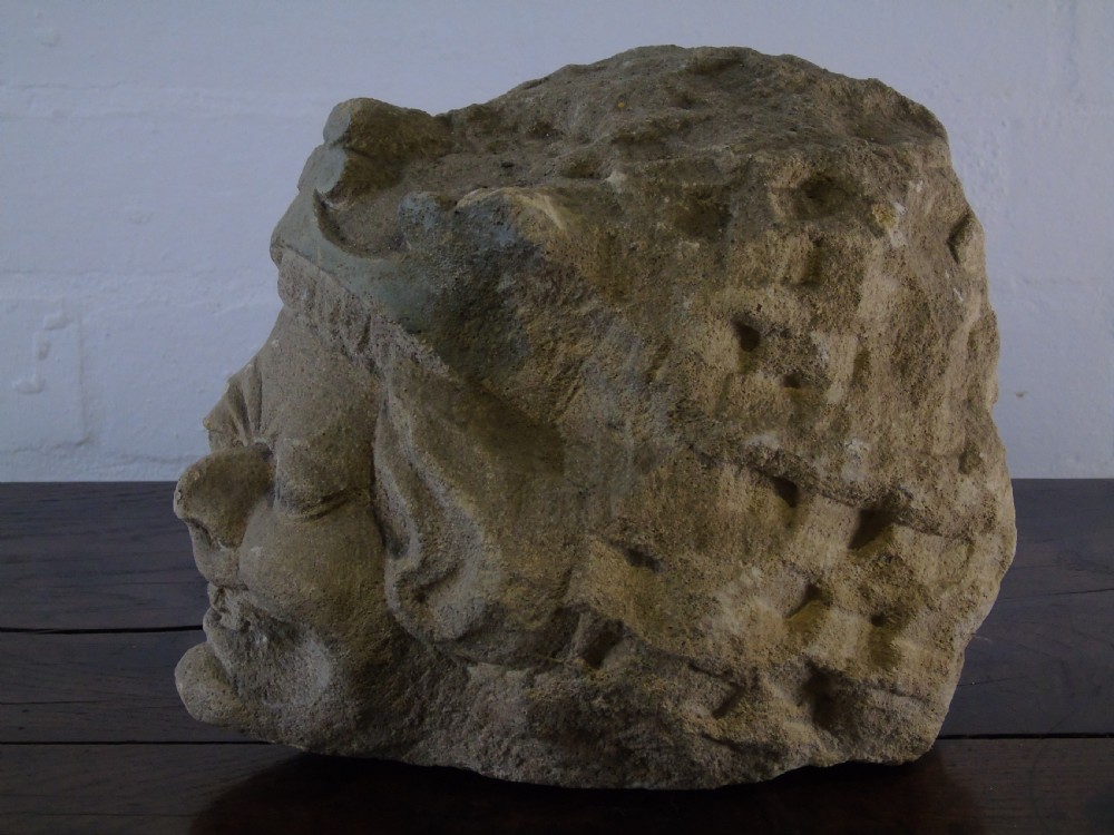 An early Grotesque stone head of a king possibly 17th Century  View III