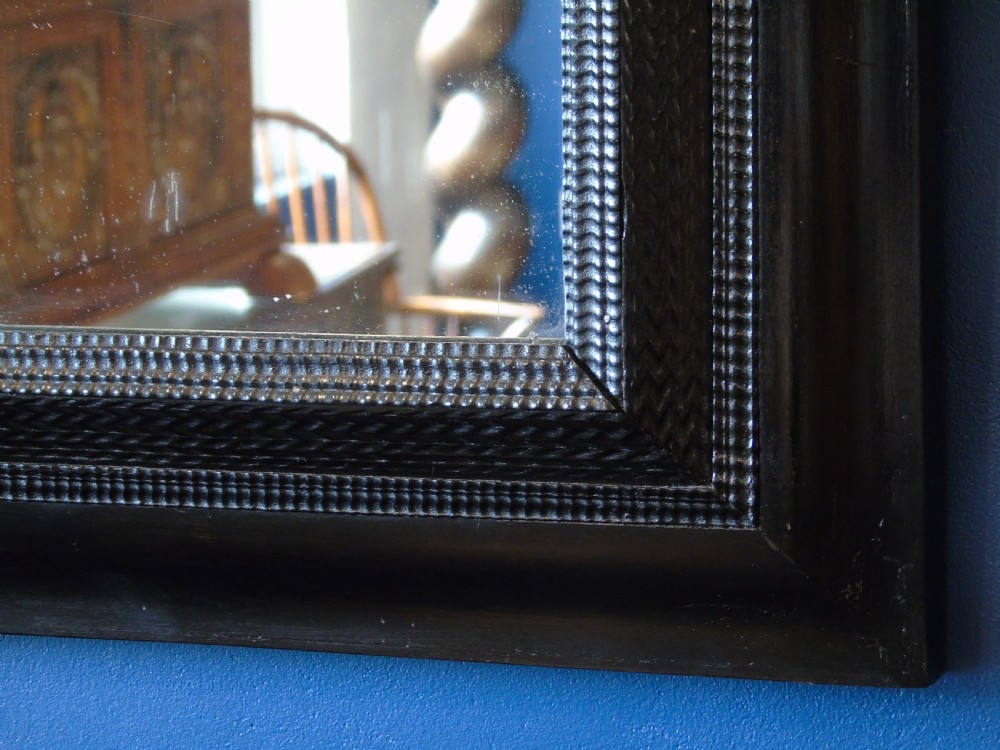 A fine late 17th-early 18th Century ripple molded mirror View V