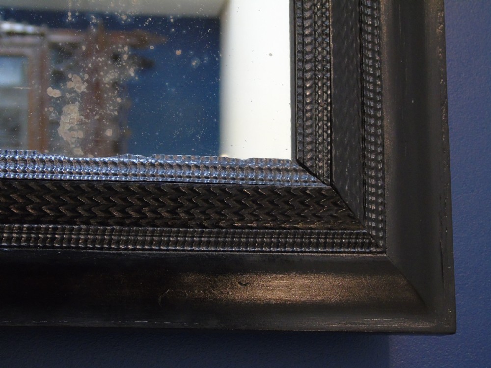 A fine late 17th-early 18th Century ripple molded mirror View VIII