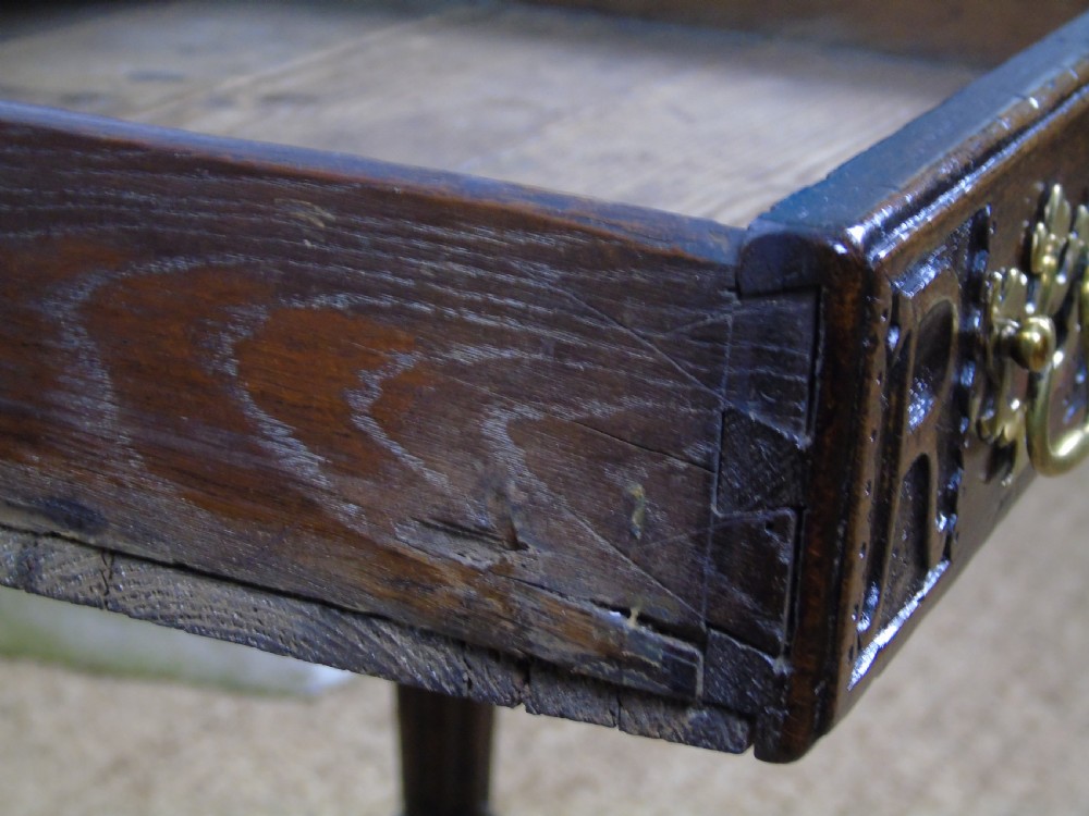 A fabulous 17th century oak side table View XXI