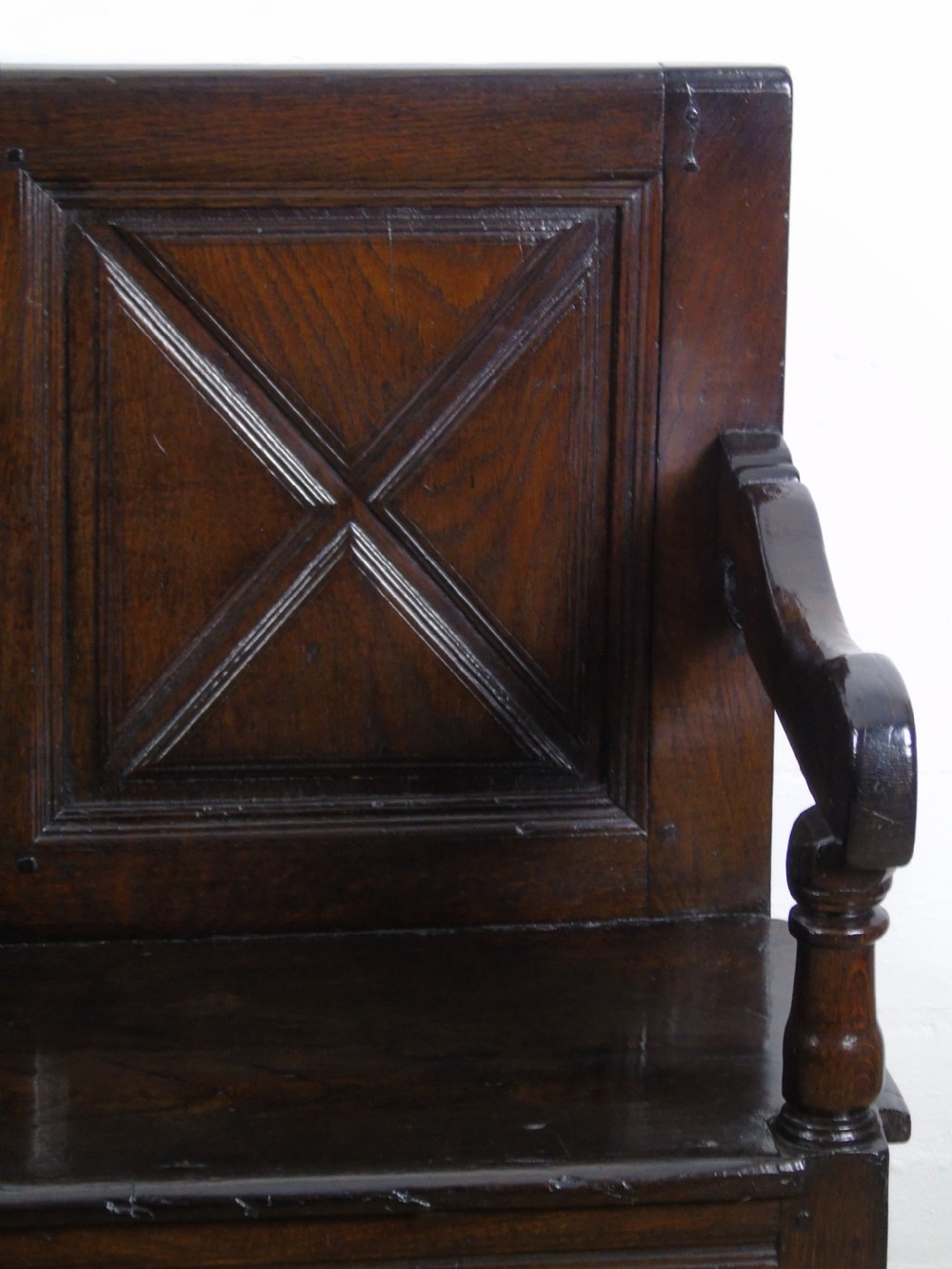 A rare and unusual early 17th Century settle.  View III