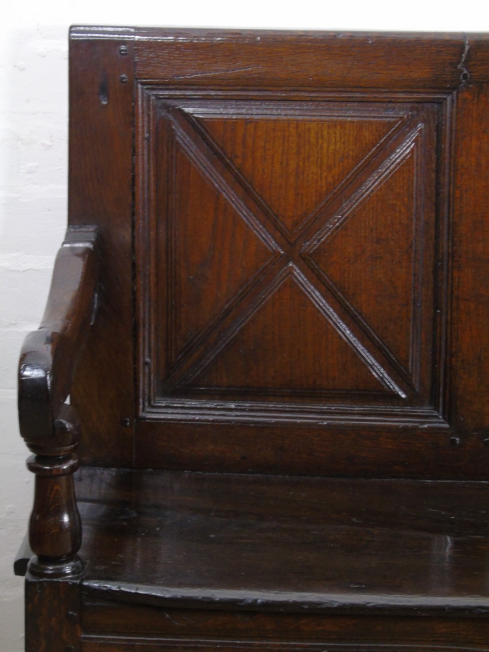 A rare and unusual early 17th Century settle.  View IV