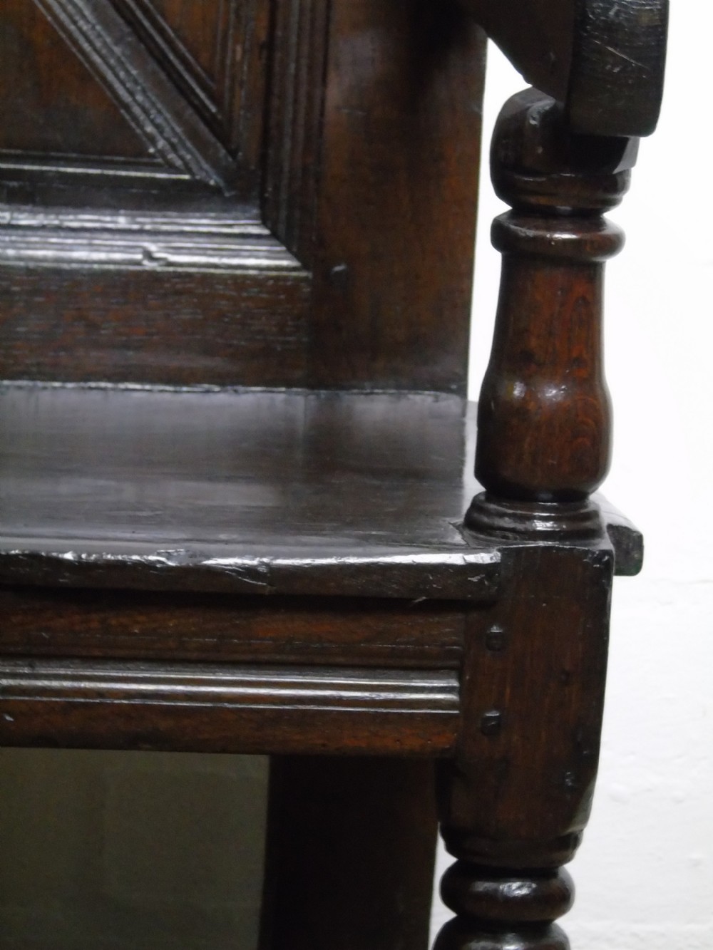 A rare and unusual early 17th Century settle.  View VIII