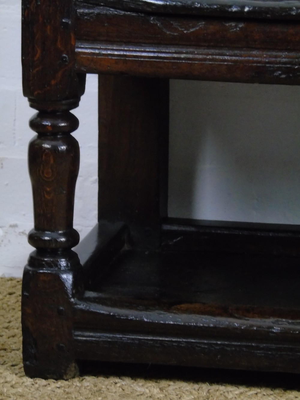A rare and unusual early 17th Century settle.  View XI