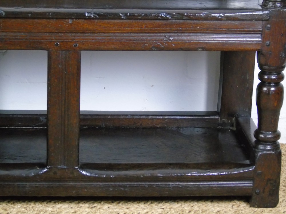 A rare and unusual early 17th Century settle.  View XIV