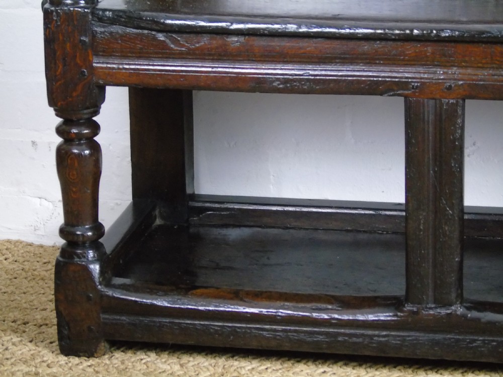A rare and unusual early 17th Century settle.  View XV