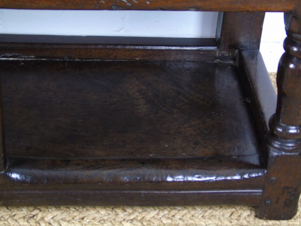 A rare and unusual early 17th Century settle.  View XVI