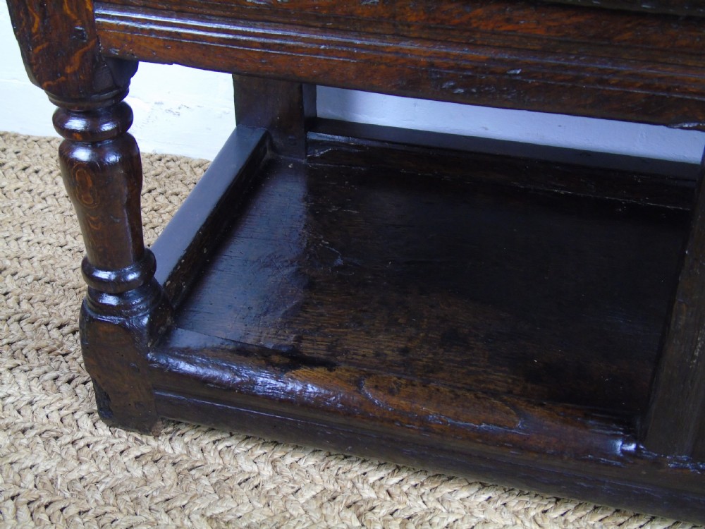 A rare and unusual early 17th Century settle.  View XVII