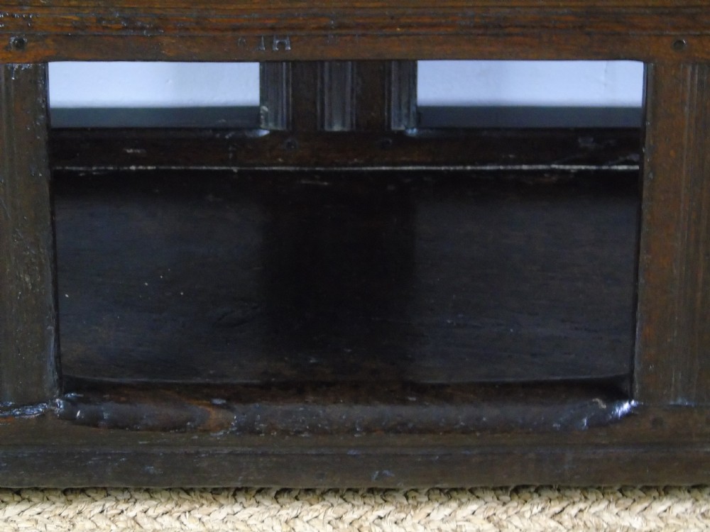 A rare and unusual early 17th Century settle.  View XVIII