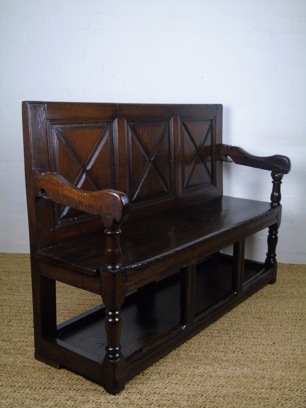 A rare and unusual early 17th Century settle.  View XXI