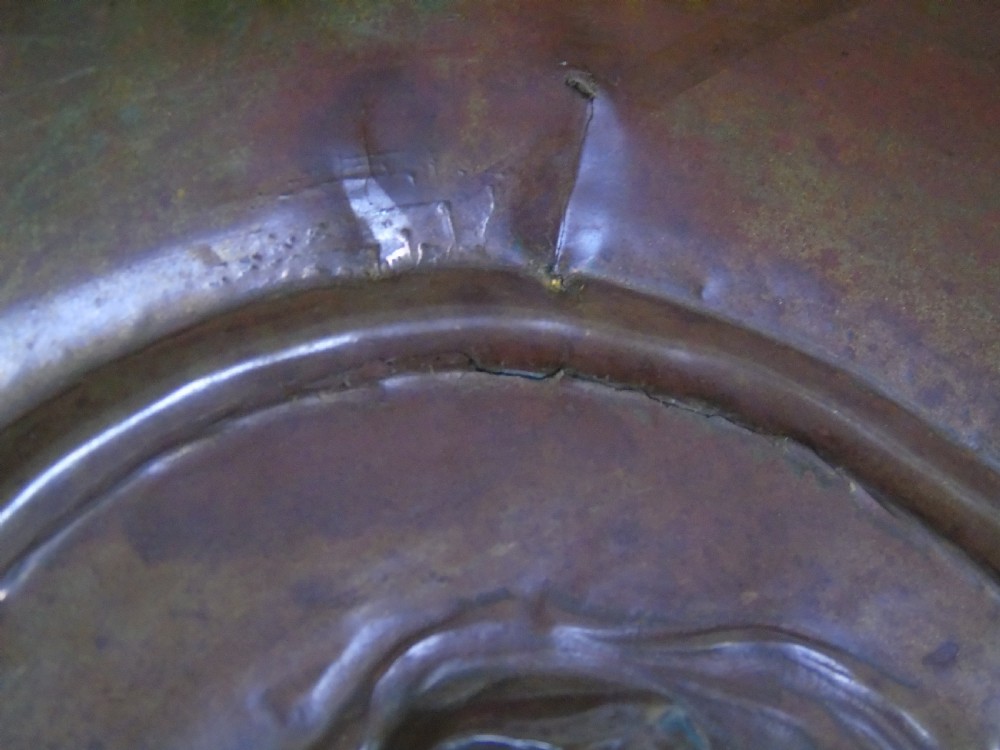 An early 18th Century repousse copper wall hanging platter View X