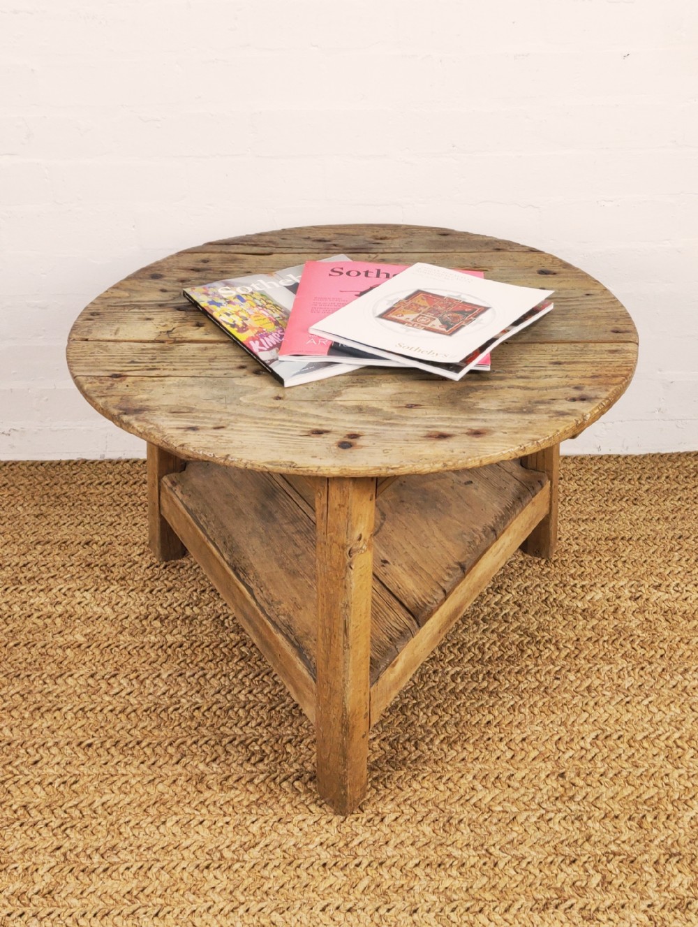 A rustic early 19th century low cricket table
