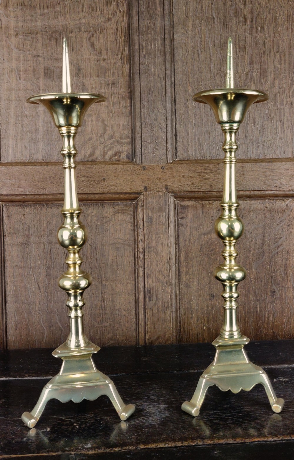 A large pair of 17thC brass prickets