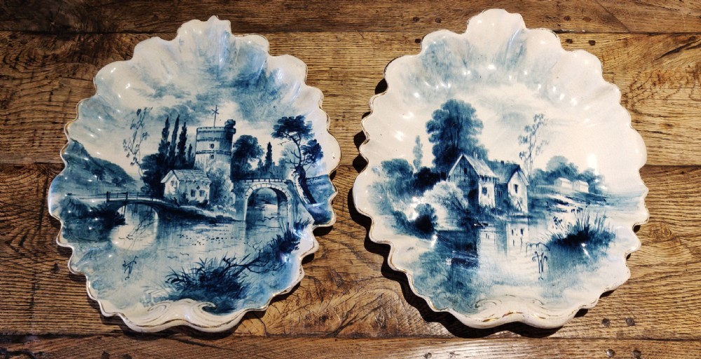 A pair of decorative blue and white plates