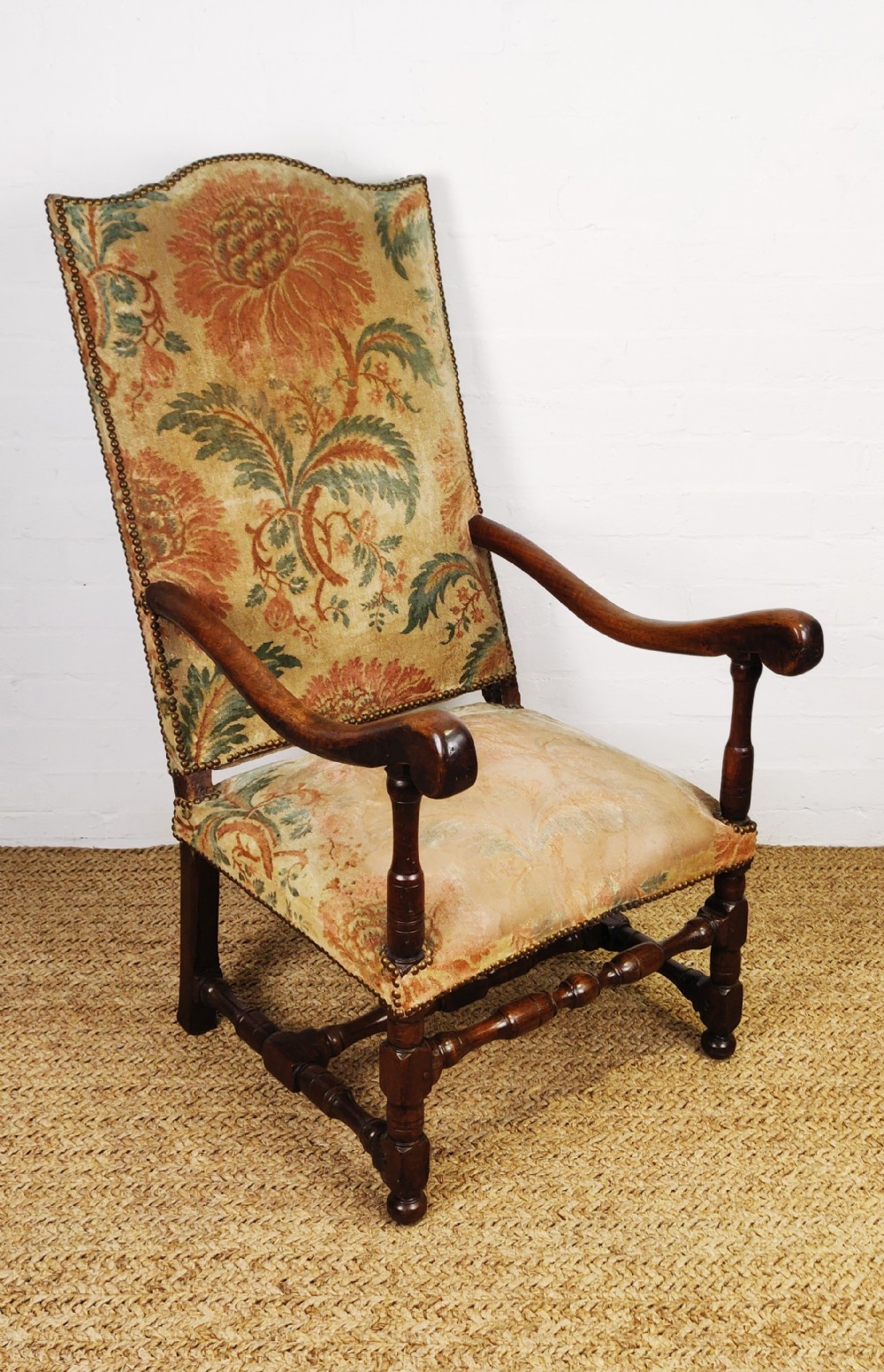 A large 17thC walnut open arm chair