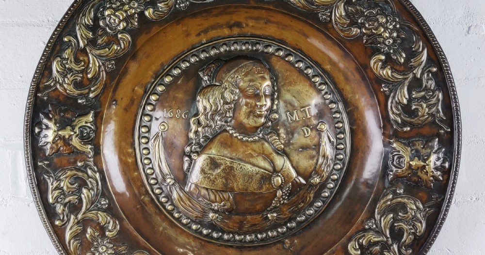 A superb 18th century copper Repoussé charger. View II