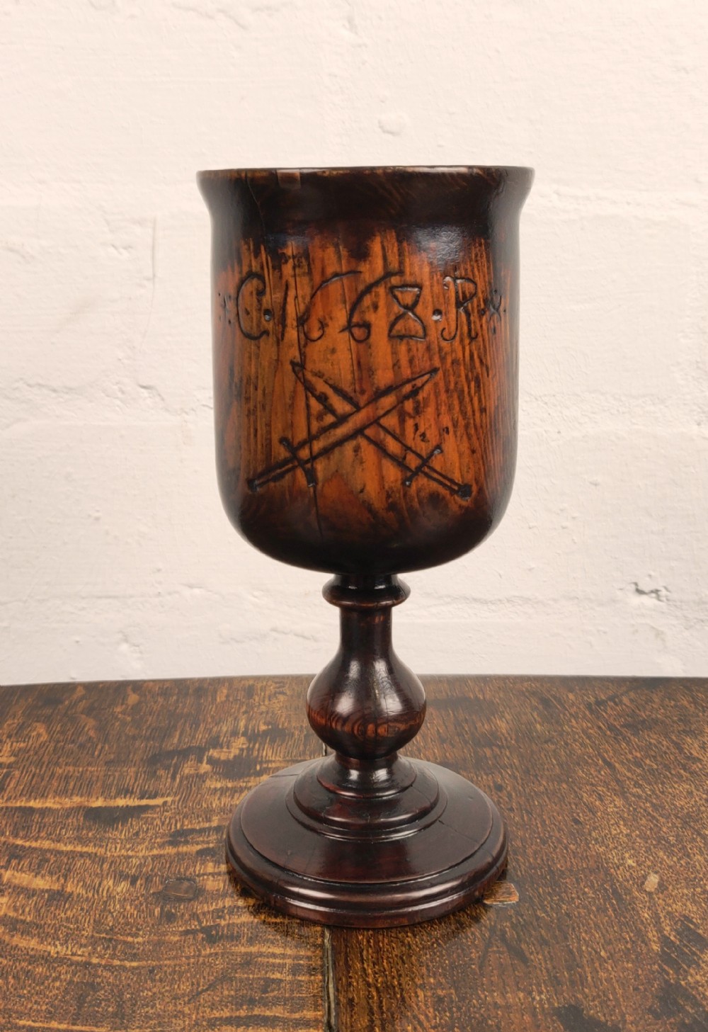 A 17th century English yew wine cup. 