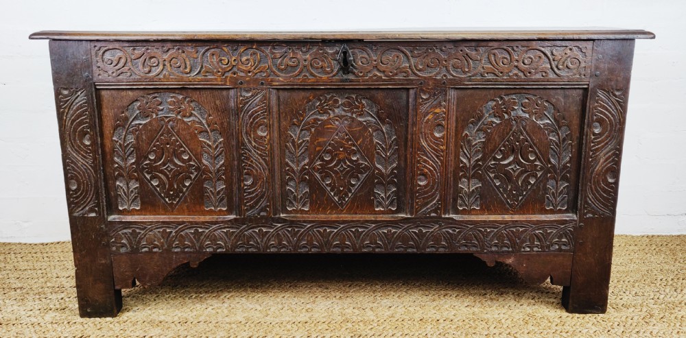 A 17th century carved coffer. 
