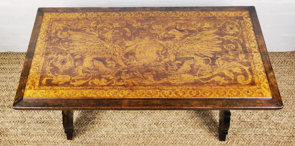 A fantastic late 19th century Italian poker work coffee table.  View VIII