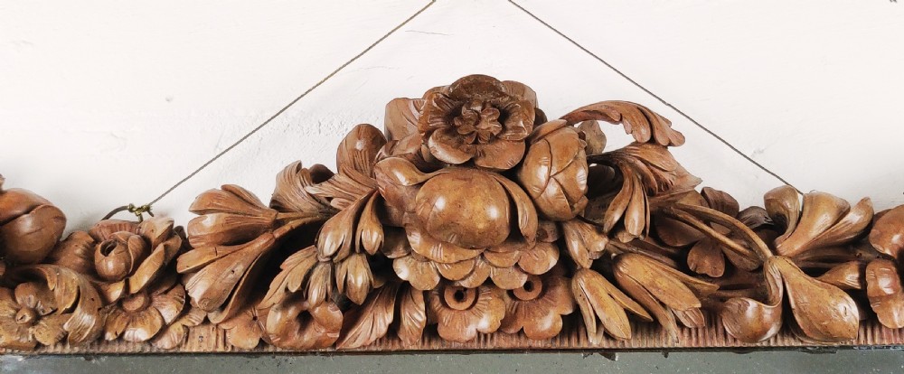 After Grinling Gibbons - a fine 18thC carved mirror. View V