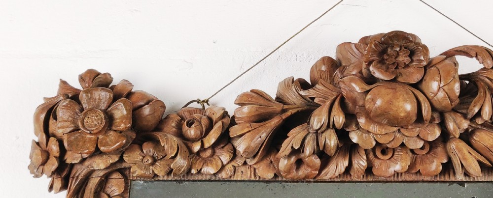 After Grinling Gibbons - a fine 18thC carved mirror. View VI