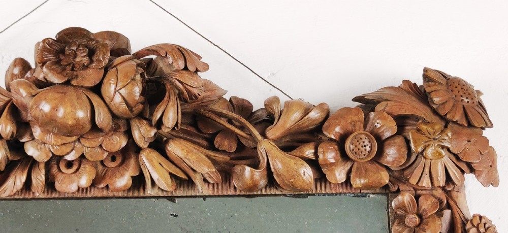 After Grinling Gibbons - a fine 18thC carved mirror. View VII
