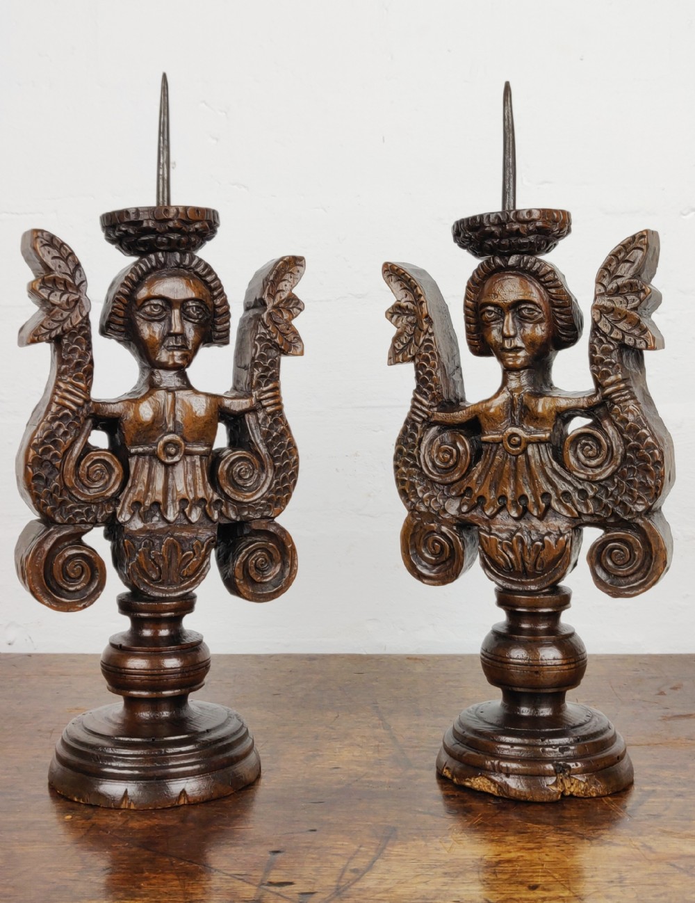 A Rare pair of late Elizabethan walnut prickets. 
