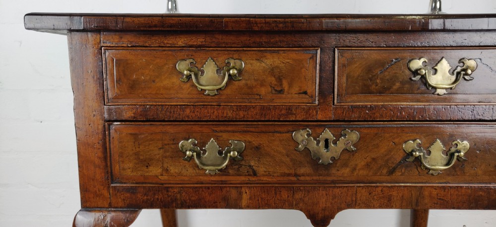 A small 18th century walnut lowboy.  View III