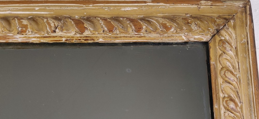 A late 18th - early 19th century carved mirror.  View V