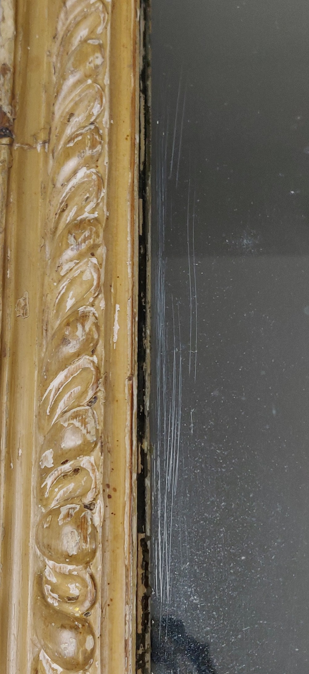 A late 18th - early 19th century carved mirror.  View VI
